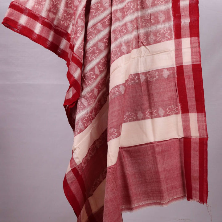 White and red Sambalpuri cotton dupatta with intricate motif patterns, draped over a traditional outfit