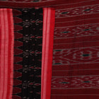 Black cotton Sambalpuri saree with red motifs, draped on a model