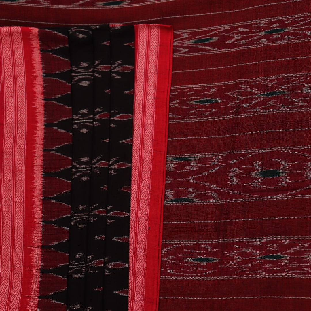 Black cotton Sambalpuri saree with red motifs, draped on a model