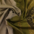 Plain green Sambalpuri cotton saree, showcasing elegant drape.