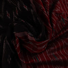 Model wearing a black and red Sambalpuri cotton saree, showing drape and overall style.