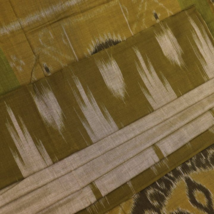 Plain green Sambalpuri cotton saree, showcasing elegant drape.