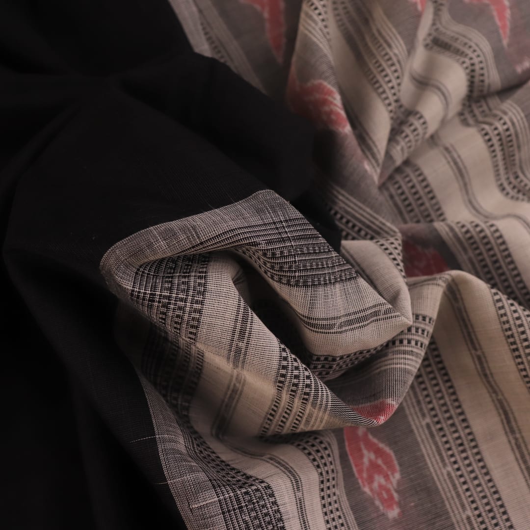 Full view of a plain black and white Sambalpuri cotton handloom saree.