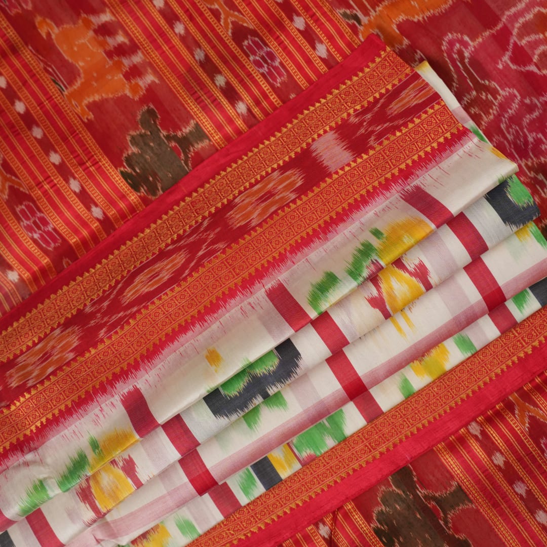 Model styled in a white and red Khandua silk saree showcasing its elegant fall and traditional Odia motifs.