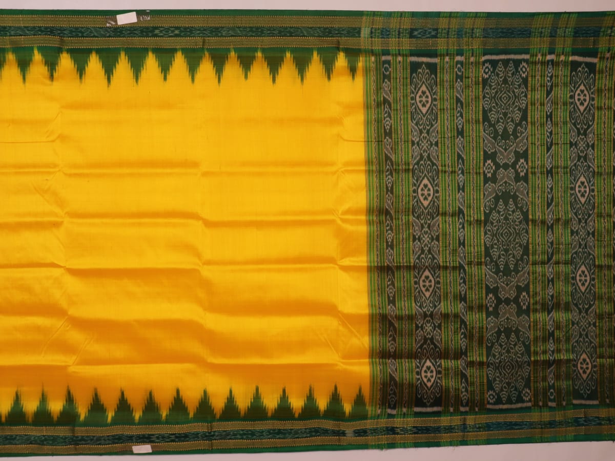 Yellow Khandua silk saree draped, showcasing its simple elegance and the plain body.