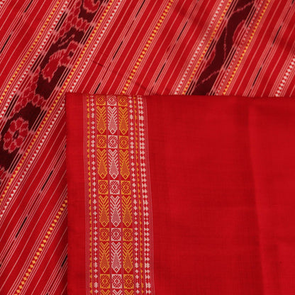 Close-up of the distinct handwoven texture of a red Sambalpuri silk saree with Butta pattern.