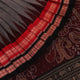 Full view of grey Bomkai cotton saree, featuring black border and butta pattern.