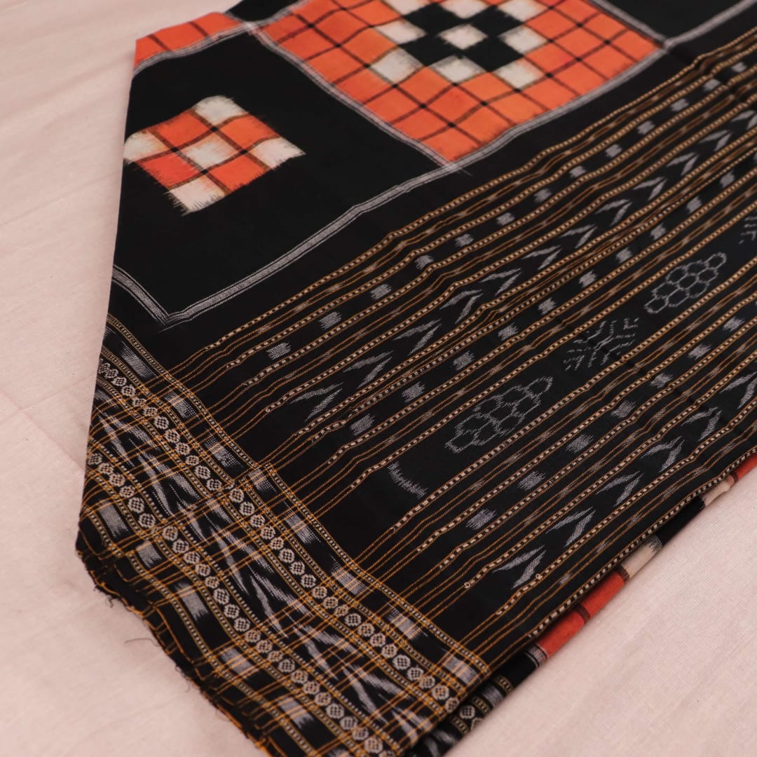 Rust and black Sambalpuri cotton dupatta with Pasapalli design draped gracefully showcasing its beauty