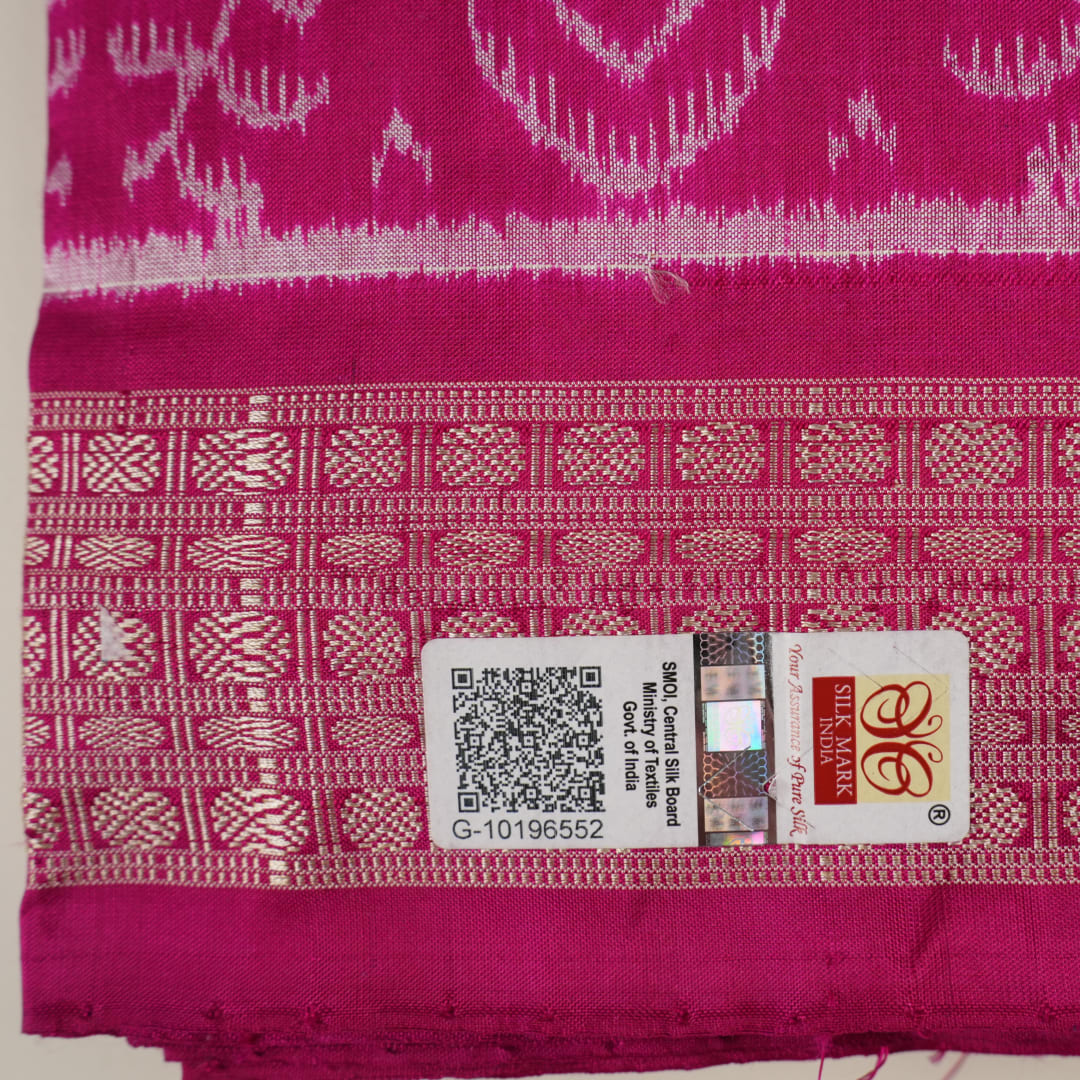 Detail of the luxurious silk texture and exquisite handloom weave of the Multi-color Pink Sambalpuri Saree.