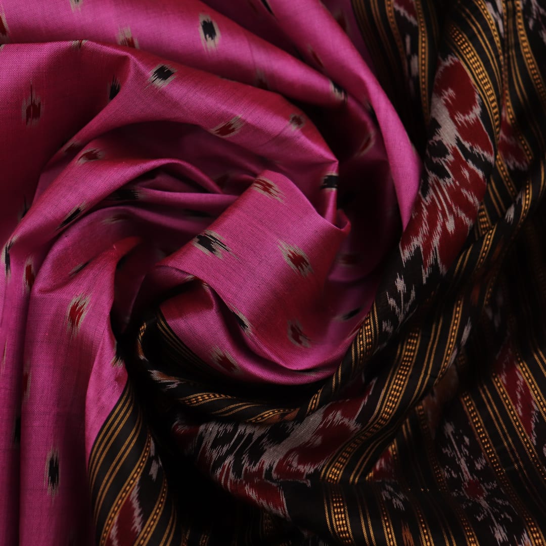 Pink Khandua Silk Saree with black motifs, styled and draped in traditional fashion