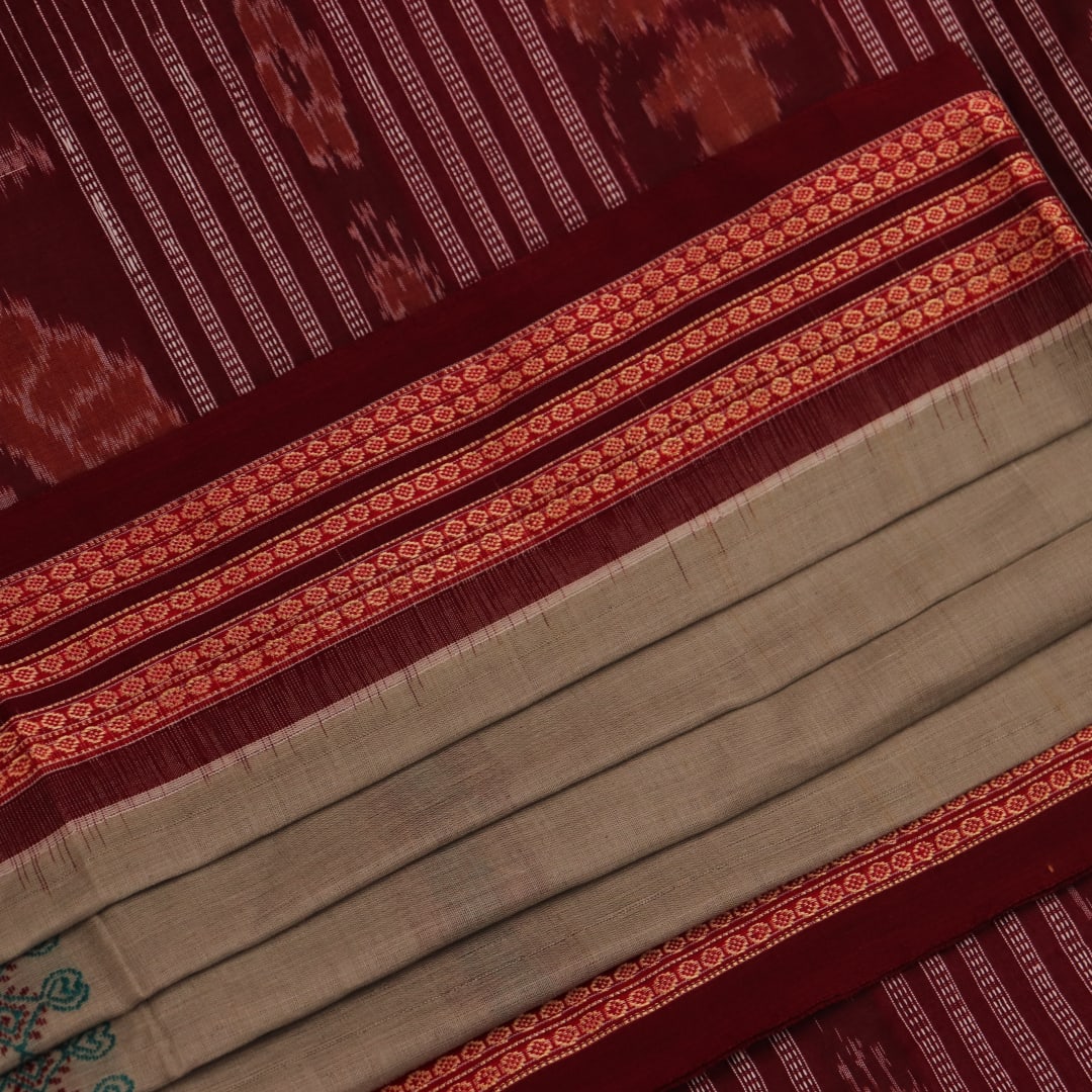 Full view of a traditional green and maroon cotton Bomkai saree featuring a butta pattern.