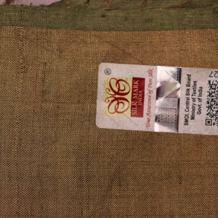 Close-up view of grey Tussar silk saree with intricate motifs on its textured fabric