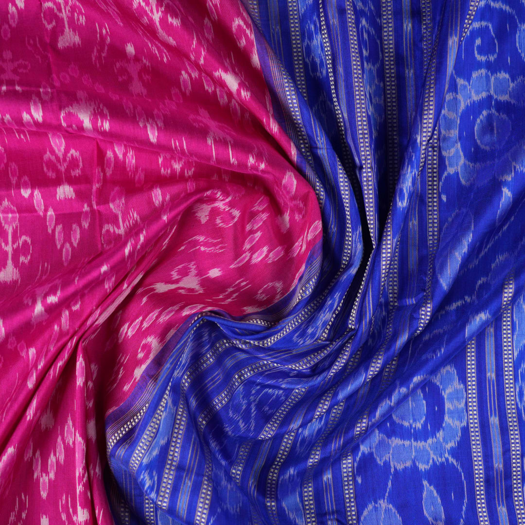 Close-up showing the luxurious handloom silk fabric texture and fine weave of the pink Sambalpuri saree.