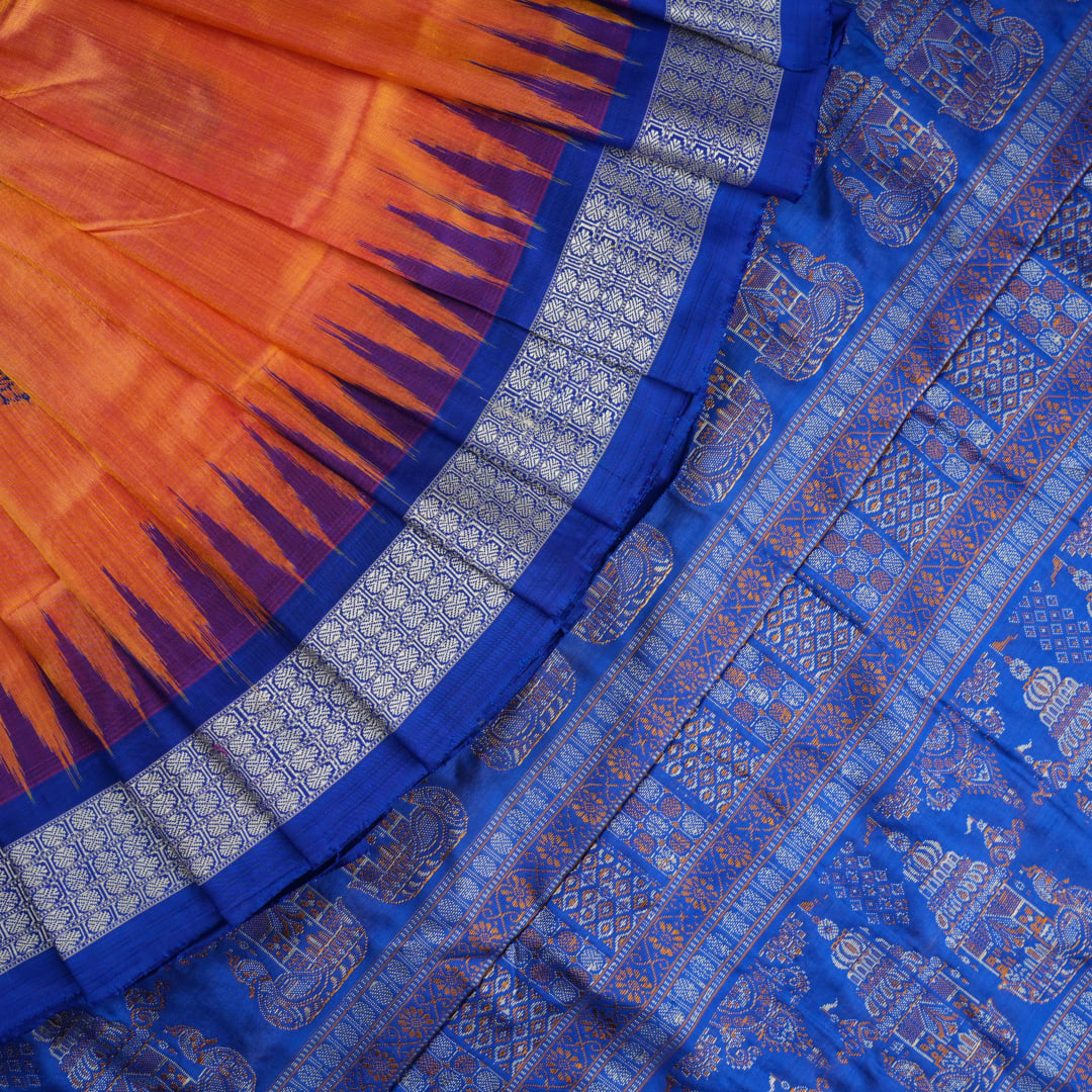 Close-up of Bomkai Silk Saree fabric texture and handloom weave in orange and blue threads.