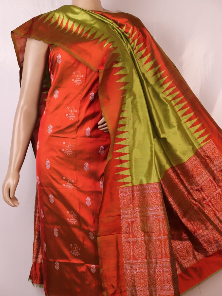 Detail of rust and green Bomkai silk blouse piece with butta pattern.
