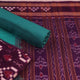 Detail of the purple and green Sambalpuri Pasapalli cotton dress material's blouse piece.