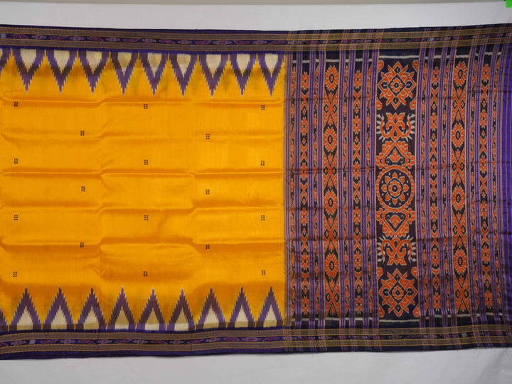 Full styling view of a model draped in a vibrant yellow and blue handloom Khandua silk saree with butta work.