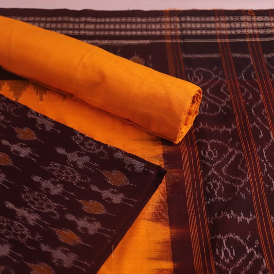 Detail of maroon and yellow Sambalpuri cotton dress material's blouse piece with motifs.