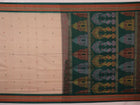 Full view of a cream and green cotton Bomkai Saree with butta pattern.