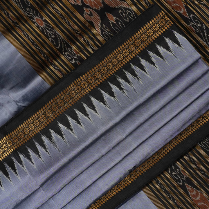 Full styling view of a model wearing a grey and black Khandua silk saree featuring elegant butta motifs.