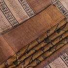 Close-up of printed multi-color handloom Tussar silk saree fabric texture.