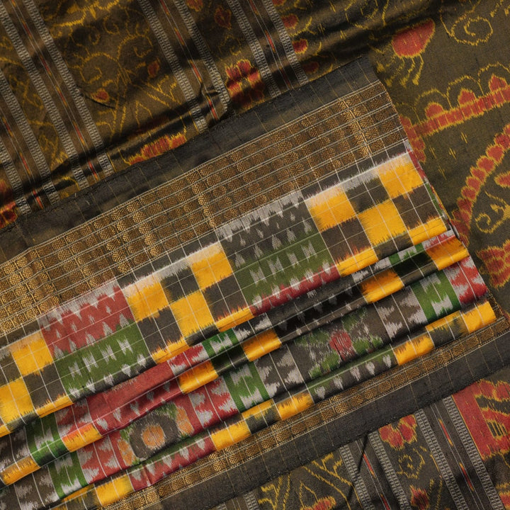 Extreme close-up of Sambalpuri Silk Saree fabric, revealing multi-color brown weave and tissue texture.