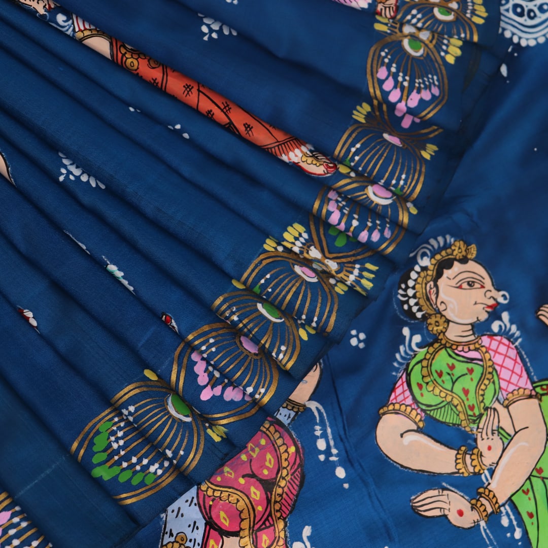 Close-up of the handwoven blue Patachitra silk saree, showcasing the detailed texture of the fabric.