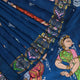 Close-up of the handwoven blue Patachitra silk saree, showcasing the detailed texture of the fabric.