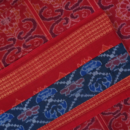 Full flat lay view of a blue and red Sambalpuri cotton saree showcasing the entire body and pallu design.