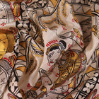 Close-up of white silk Patachitra saree, showcasing the handloom fabric's texture and subtle paint details.