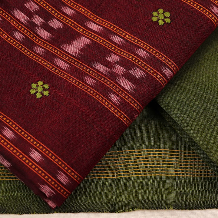 Detail view of the blouse piece with intricate Sambalpuri motifs in maroon and green on cotton fabric.