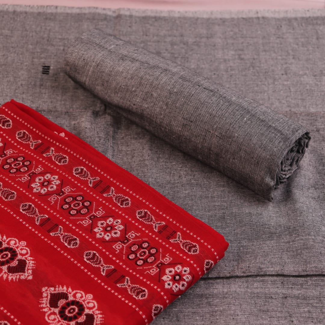 Close-up of the red and grey Bomkai cotton blouse piece with subtle pattern.