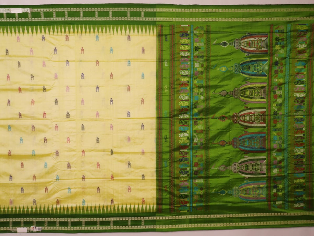 Close-up of cream and green Bomkai Silk Saree fabric texture with butta pattern.