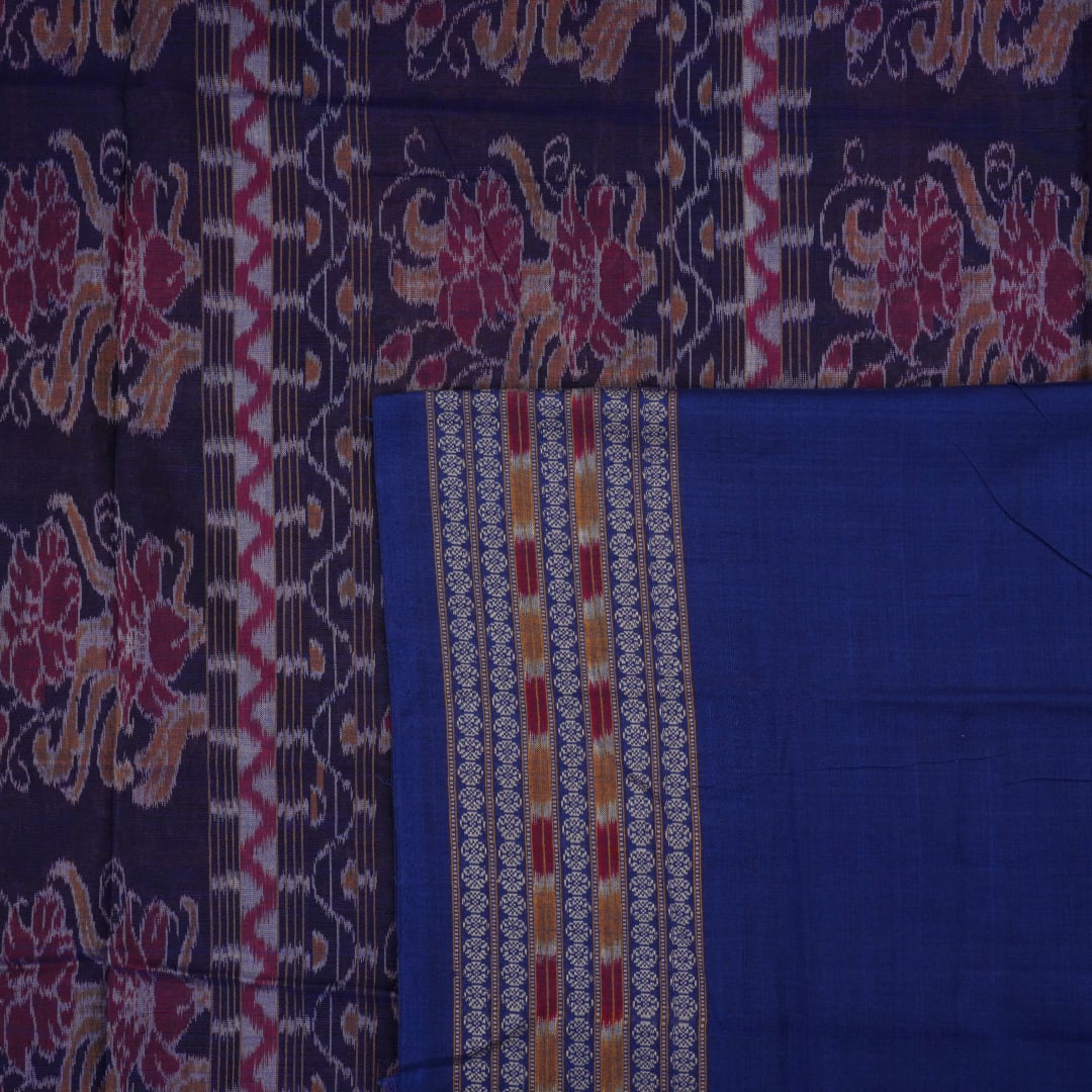 Full flat layout of maroon and blue Sambalpuri cotton saree with traditional motifs and ikat border.