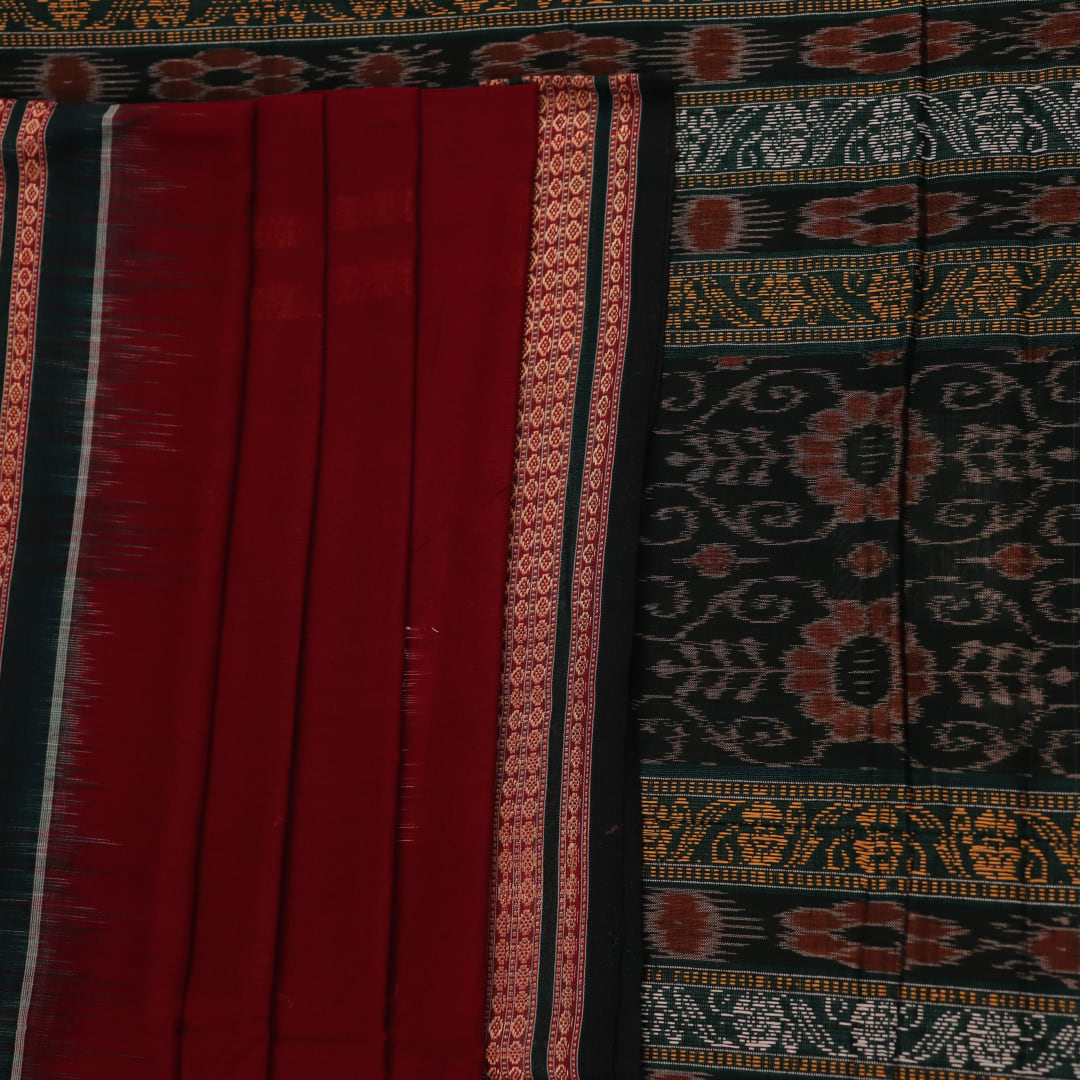 Full view of a maroon cotton Bomkai saree with green butta pattern throughout.