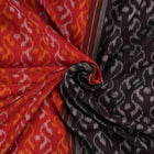 Model draped in a maroon and black Sambalpuri cotton saree showcasing elegant traditional handloom style