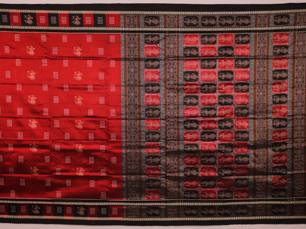 Close-up of maroon silk fabric with delicate butta patterns in black.