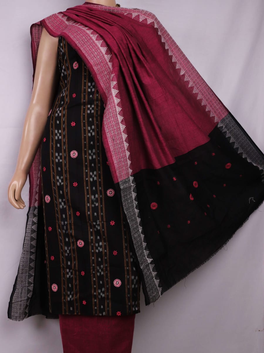 Close-up of blouse piece featuring intricate Sambalpuri motifs in black and magenta on a cotton base.