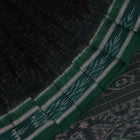 Black and green plain Sambalpuri cotton saree, gracefully draped.