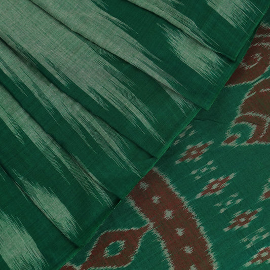 Model wearing a plain green Sambalpuri cotton saree, elegantly draped.