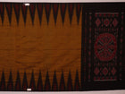 Brown and black plain Sambalpuri cotton saree styled, showcasing its elegant drape and subtle colors.