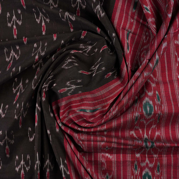 Model draped in a black and red Sambalpuri cotton saree showing traditional Odisha handloom styling.