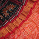 Close-up of Sambalpuri silk saree fabric, revealing rich texture, weave, and subtle tissue motifs.