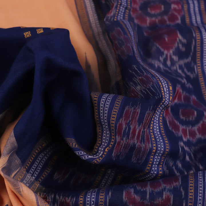 Cream cotton Bomkai saree with blue butta pattern, full view.