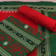 Detail of the green and red Sambalpuri cotton dress material blouse piece with motifs.