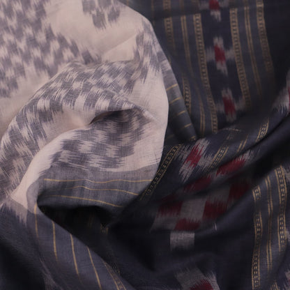 Draped view of white and grey Sambalpuri cotton saree with motifs.