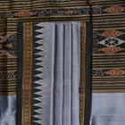 Full styling view of a model wearing a grey and black Khandua silk saree featuring elegant butta motifs.
