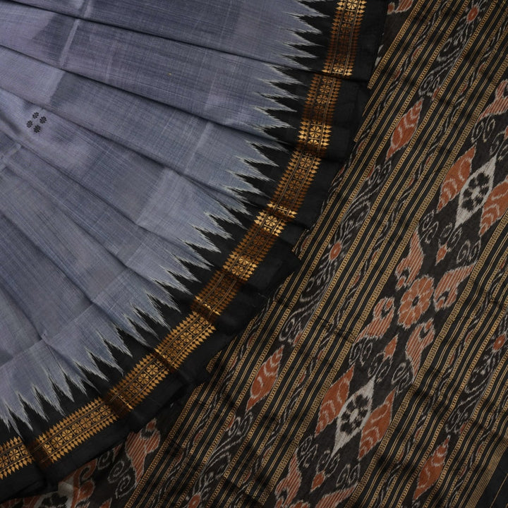 Full styling view of a model wearing a grey and black Khandua silk saree featuring elegant butta motifs.