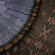 Full styling view of a model wearing a grey and black Khandua silk saree featuring elegant butta motifs.