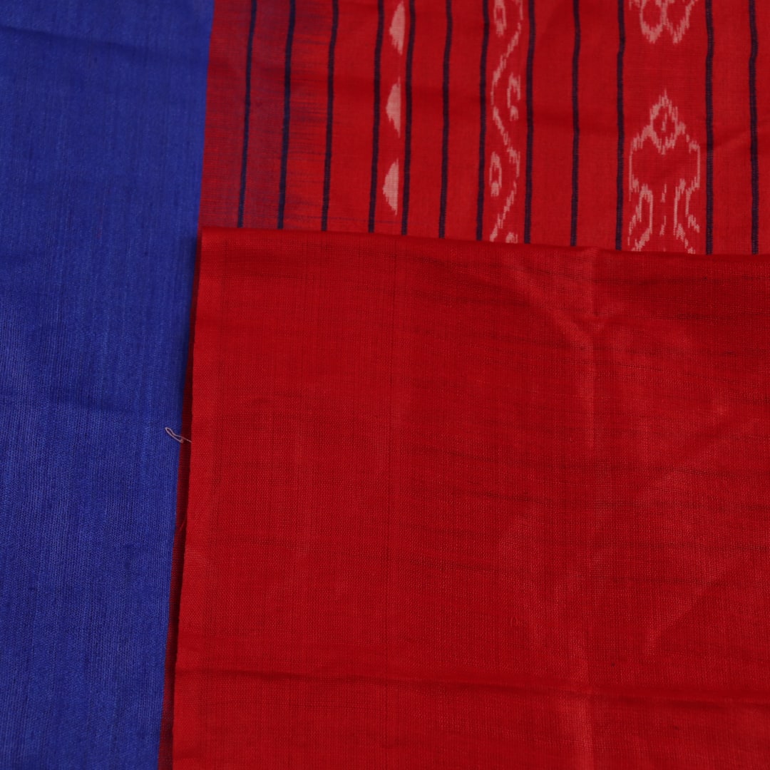 Close-up of the smooth, textured fabric of the blue Tussar silk saree.